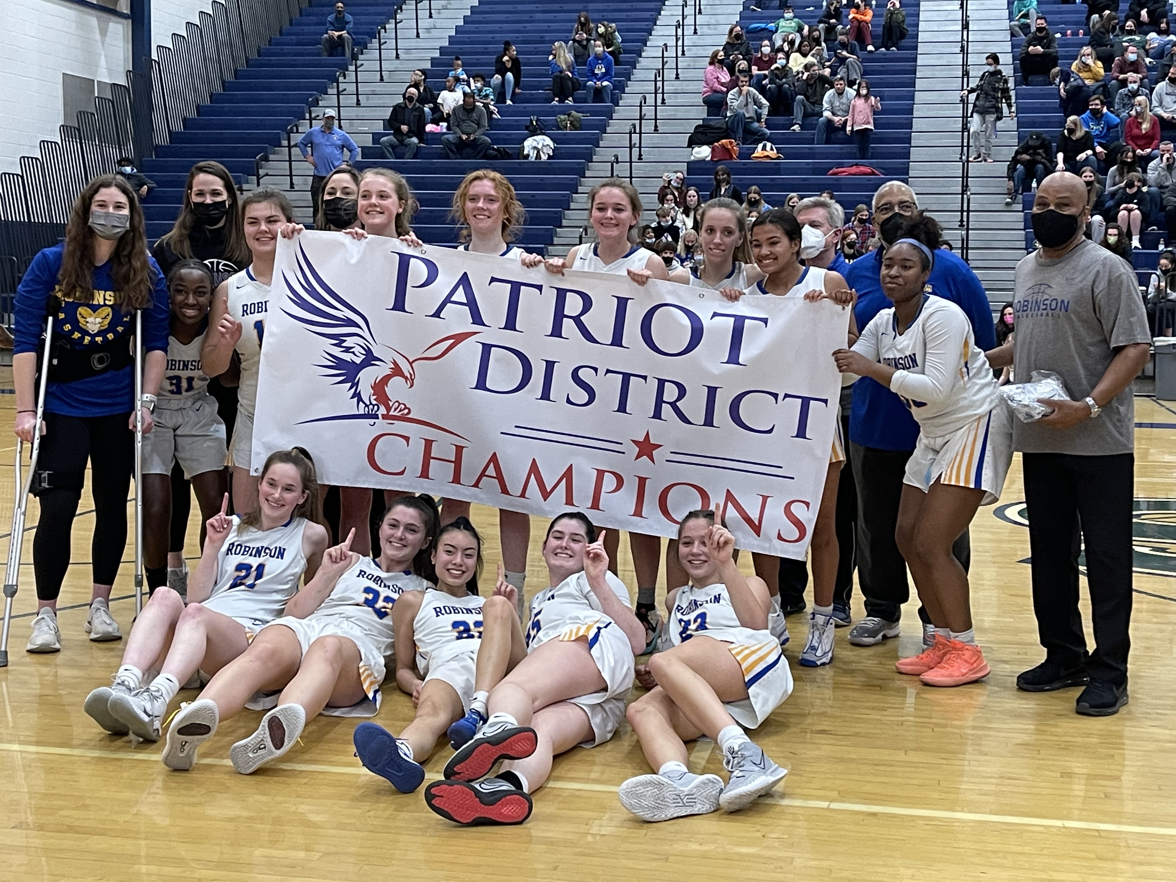 girls-basketball-with-district-championship-banner