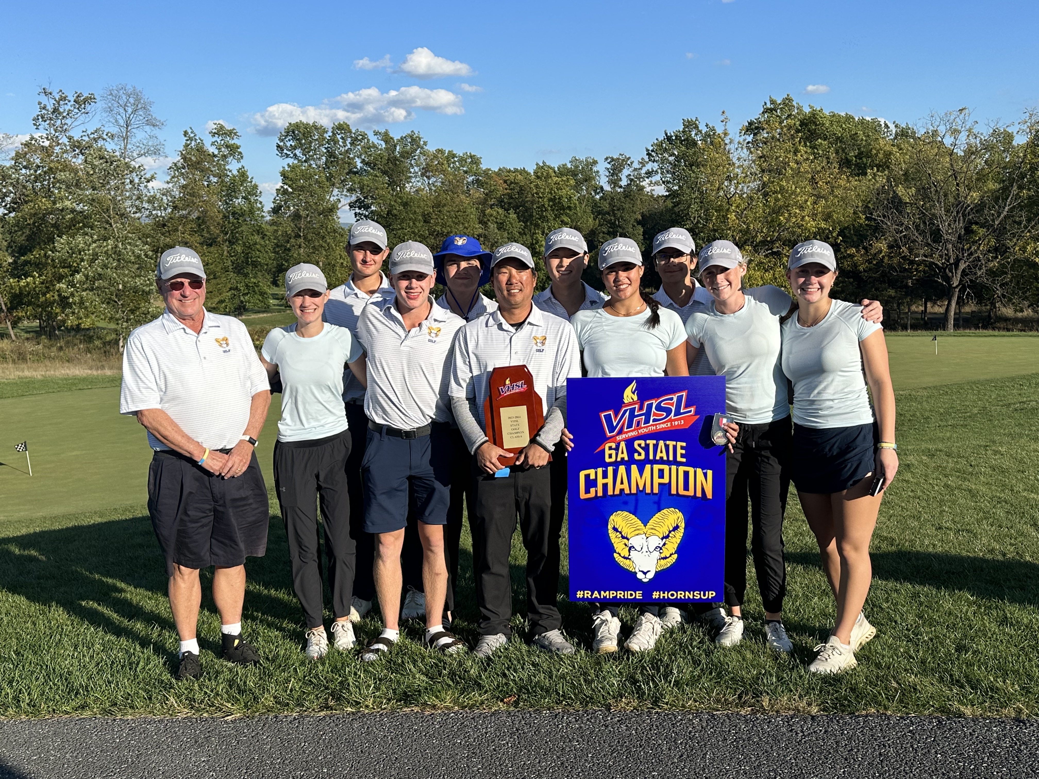Coed Golf team posing for picture after winning state title